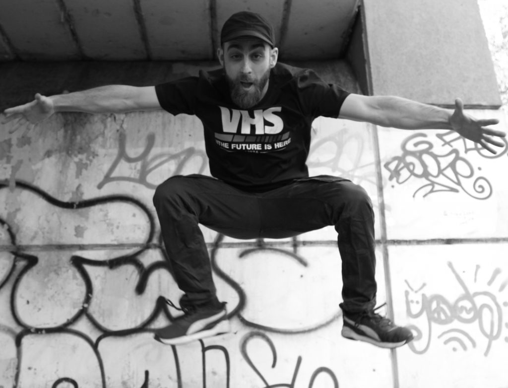 An image of Ceejay jumping high in the air