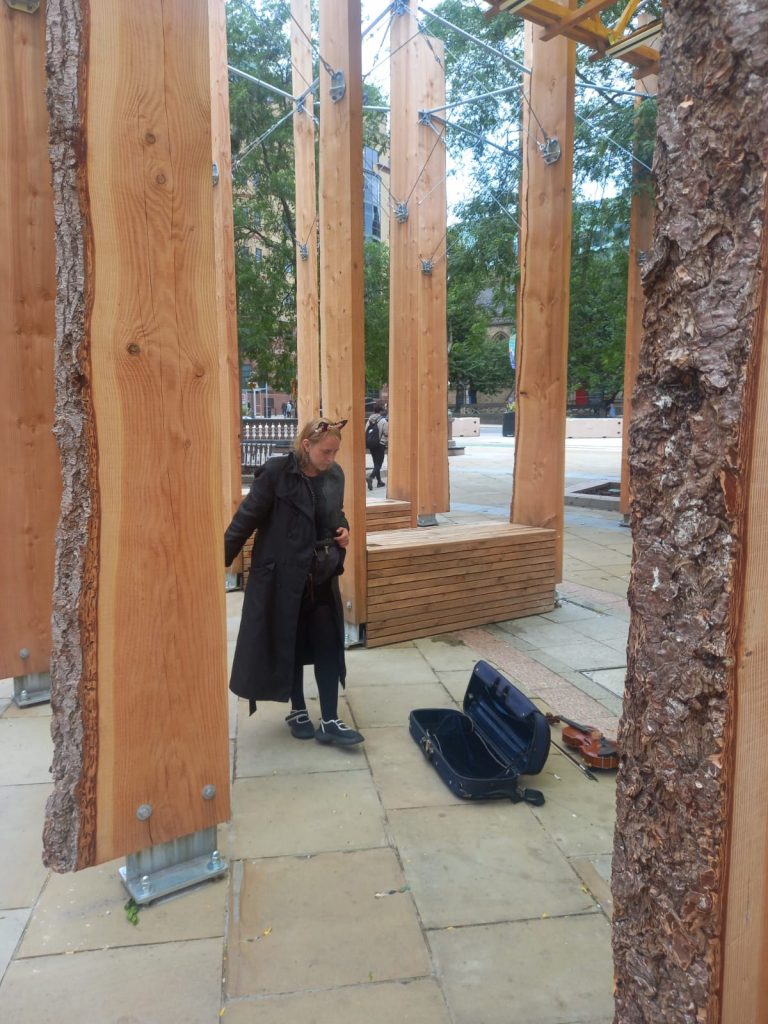 Katie in her black trench coat at City Square Leeds