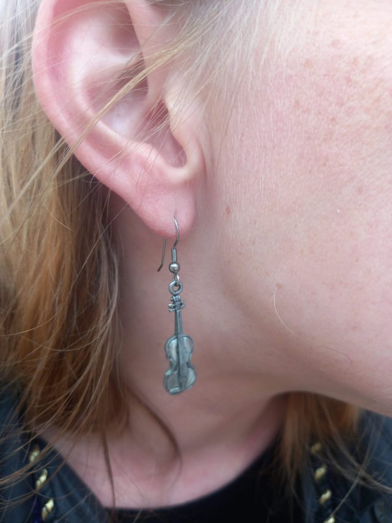 Katie wearing a violin earring