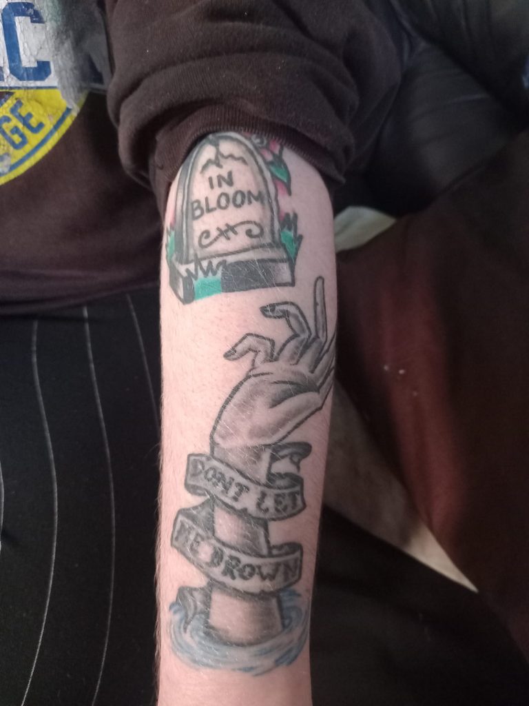 An image of Jack's forearm with tattoos. 