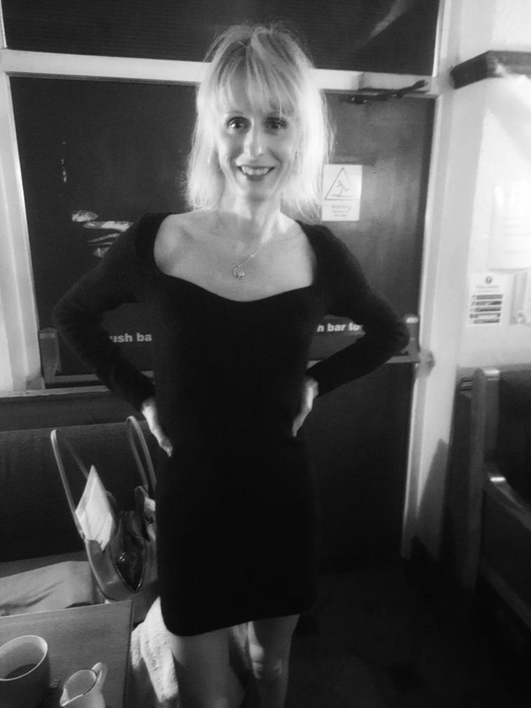 Riana McGovern with her hands on her hips looking cute.